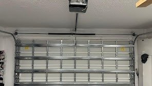 Interior face of a white sectional door with reinforcement struts